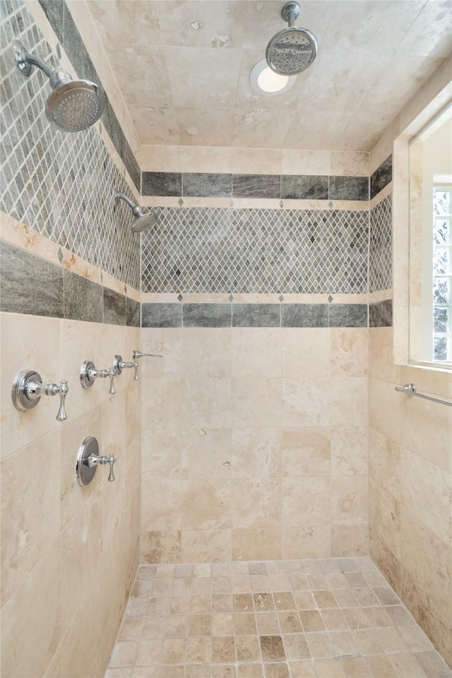 full bathroom with a tile shower