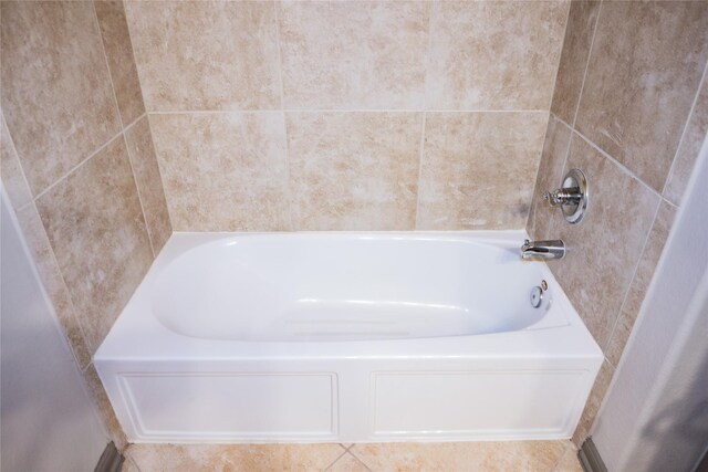 bathroom featuring walk in shower and a bathing tub