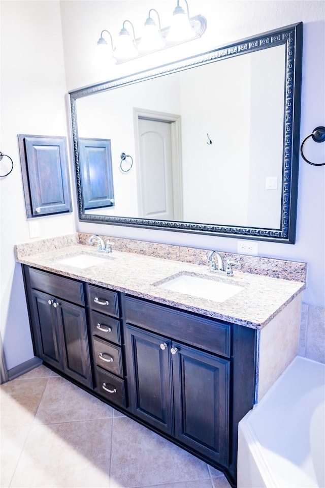 bathroom featuring tile patterned flooring, a sink, a bath, and double vanity