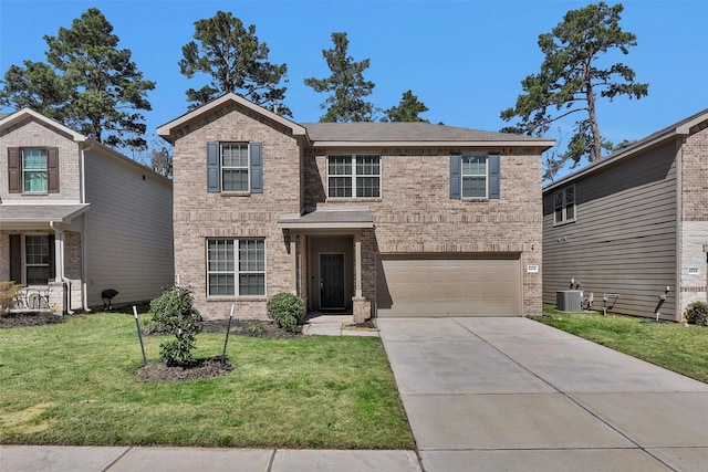 traditional-style house featuring central air condition unit, a front yard, concrete driveway, and brick siding