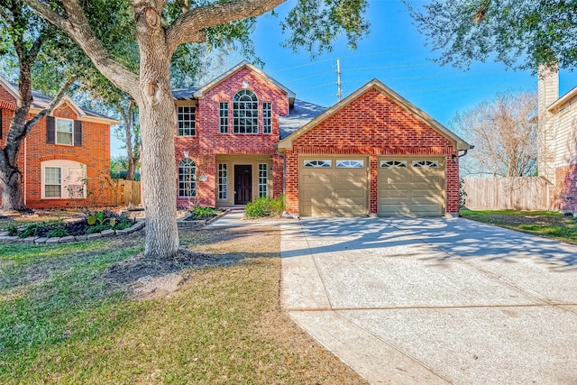 traditional-style house with brick siding, concrete driveway, a front yard, fence, and a garage