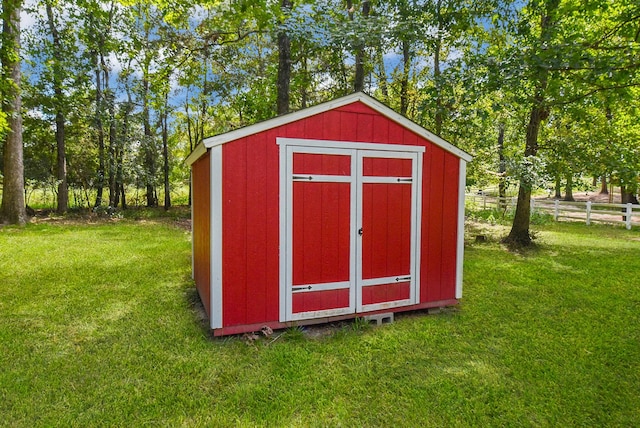 view of shed with fence