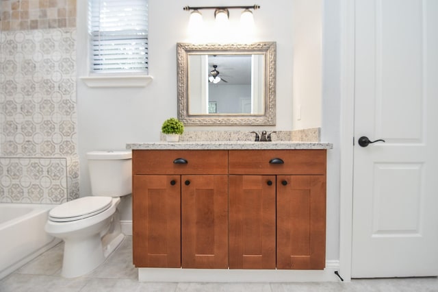 bathroom featuring shower / washtub combination, tile patterned flooring, vanity, and toilet