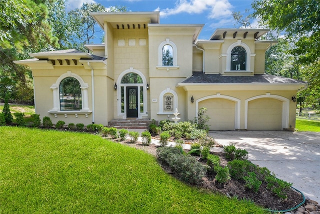 view of front of property featuring a garage, concrete driveway, a front lawn, and stucco siding