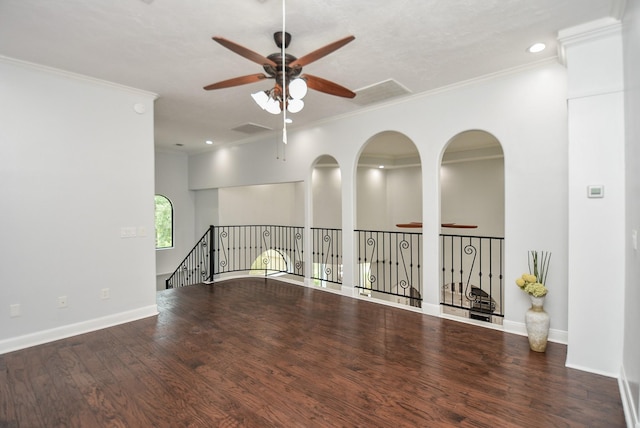 empty room with baseboards, a ceiling fan, ornamental molding, wood finished floors, and recessed lighting