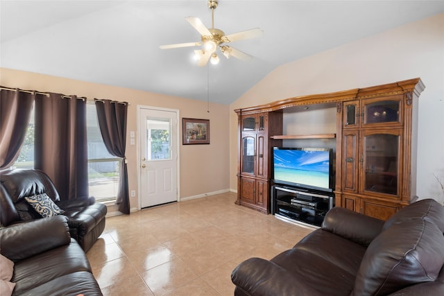 living room with baseboards, vaulted ceiling, a ceiling fan, and light tile patterned flooring