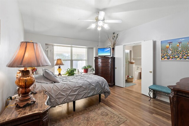 bedroom with ceiling fan, light wood finished floors, and ensuite bathroom