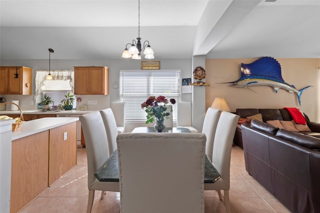 dining room featuring light tile patterned floors and a chandelier