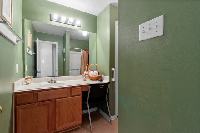 full bath featuring a shower with curtain, vanity, and tile patterned floors