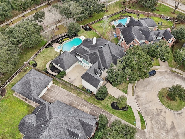 birds eye view of property with a residential view