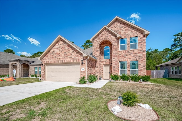 traditional-style house featuring driveway, an attached garage, a front lawn, and brick siding