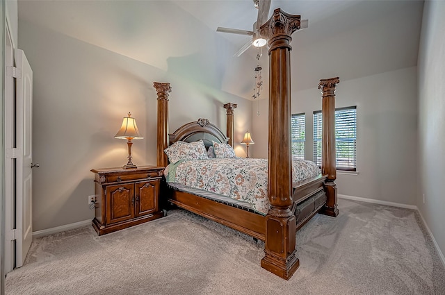 bedroom featuring light carpet, vaulted ceiling, and baseboards