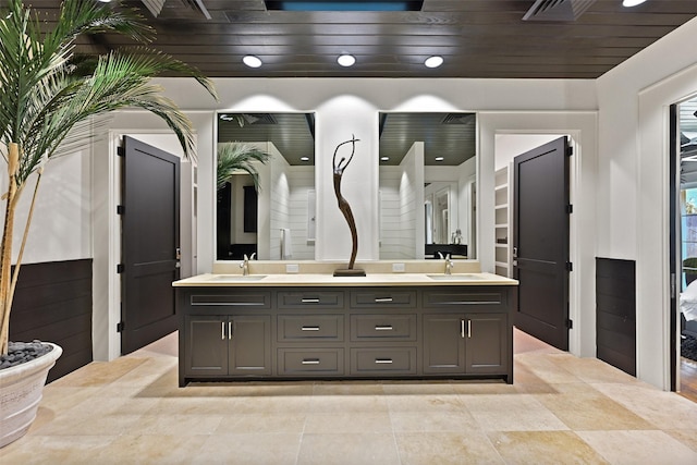 full bath featuring wooden ceiling, visible vents, a sink, and double vanity