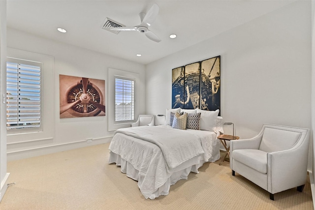 bedroom featuring light carpet, a ceiling fan, visible vents, and recessed lighting