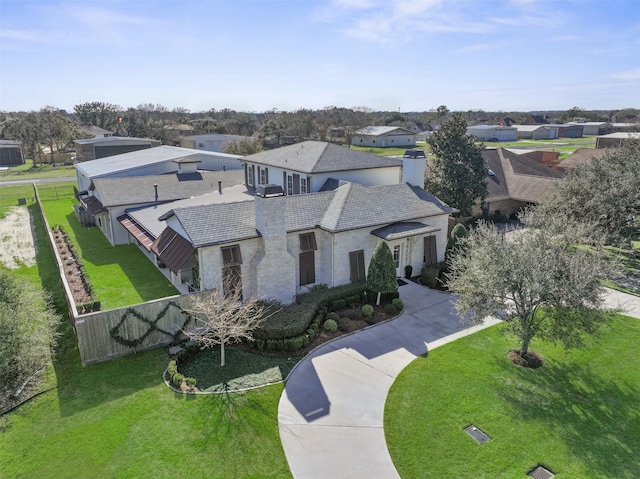 birds eye view of property with a residential view