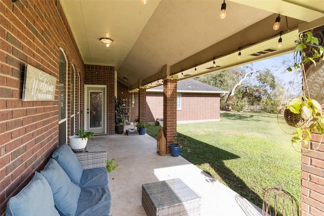 view of patio featuring fence