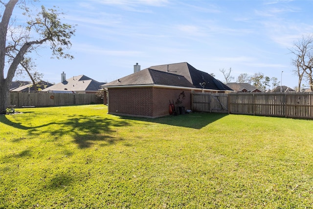 view of yard featuring a fenced backyard