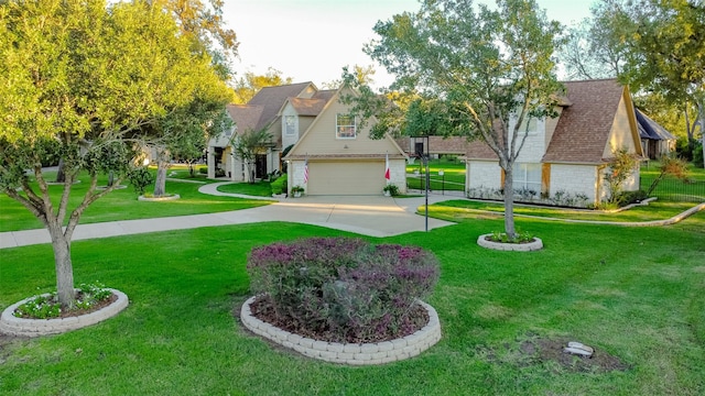 view of front of property with a garage, driveway, a front lawn, and a shingled roof