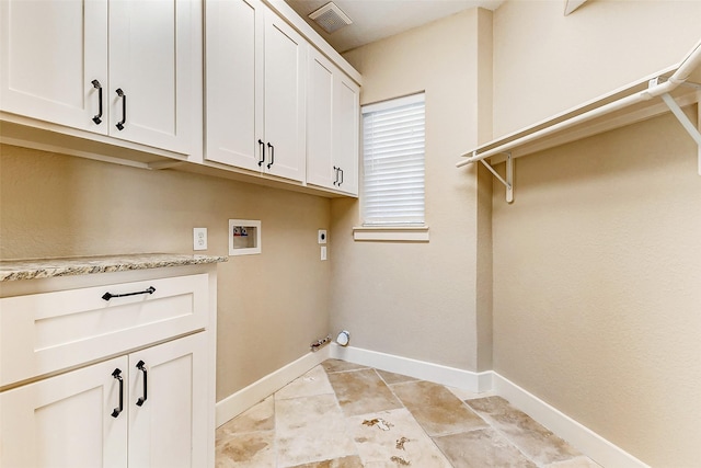 laundry room featuring hookup for a washing machine, visible vents, baseboards, cabinet space, and electric dryer hookup