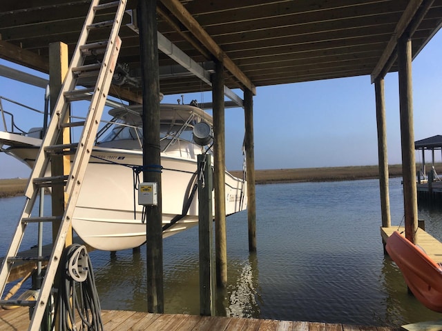 view of dock with a water view and boat lift