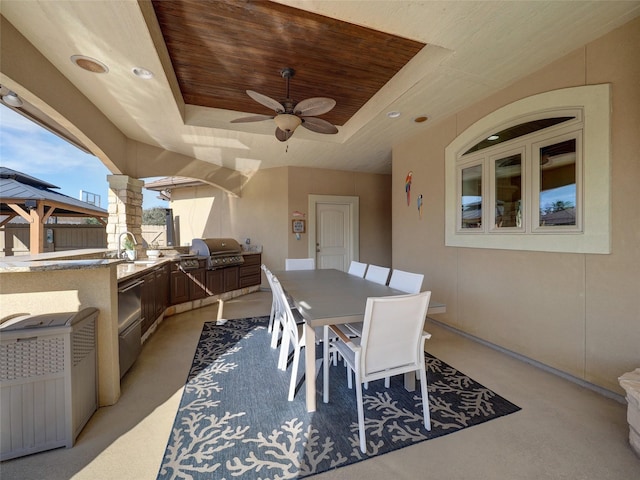 view of patio featuring a gazebo, outdoor dining area, a ceiling fan, and area for grilling