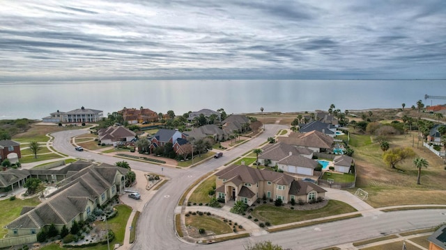 birds eye view of property featuring a water view and a residential view