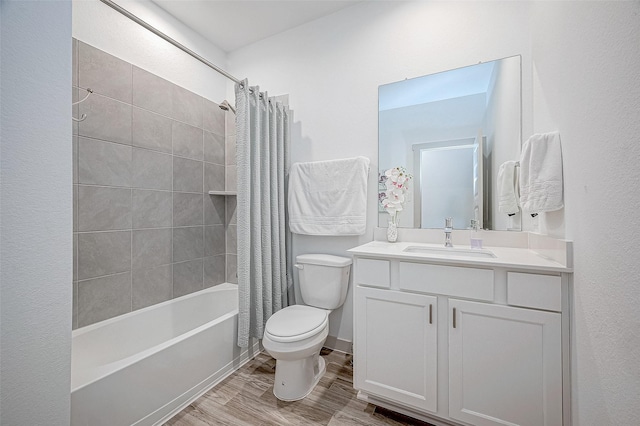 bathroom featuring toilet, shower / bathtub combination with curtain, vanity, and wood finished floors