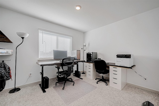 office space with light colored carpet and baseboards