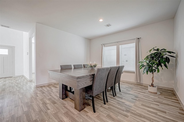 dining room featuring baseboards, recessed lighting, visible vents, and light wood-style floors