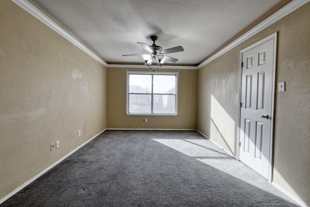 spare room with a textured wall, crown molding, carpet floors, and a ceiling fan