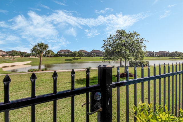 property view of water featuring a residential view and fence