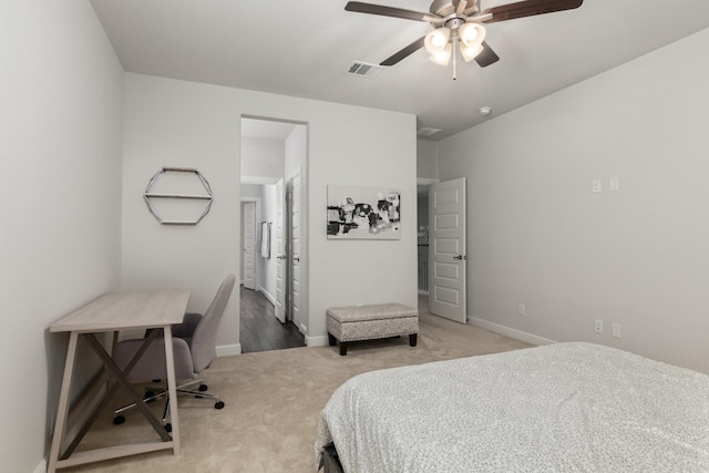 bedroom featuring visible vents, ceiling fan, light carpet, and baseboards