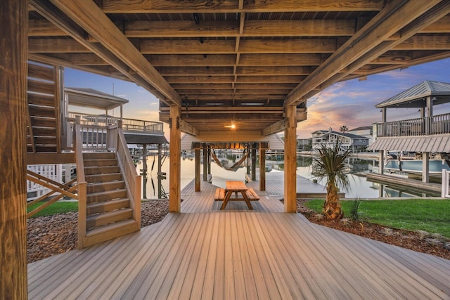 deck featuring a water view and a boat dock