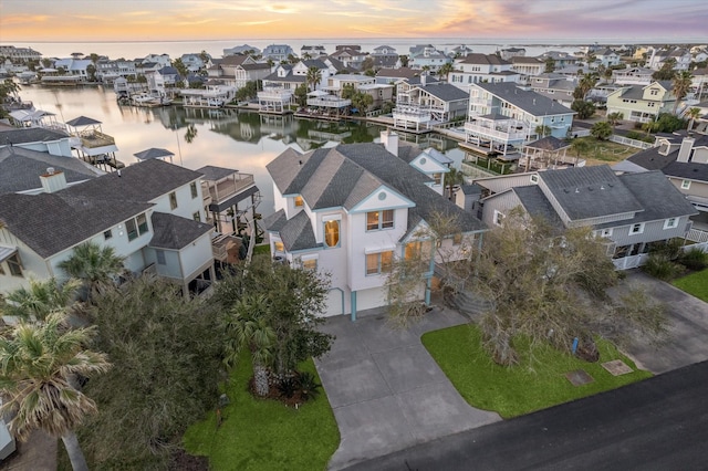 bird's eye view with a residential view and a water view