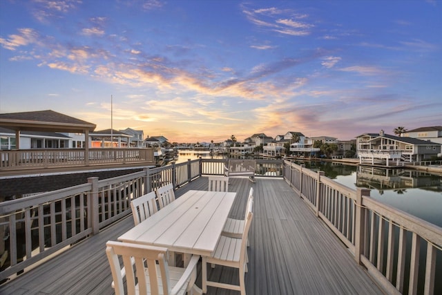 wooden deck featuring a water view