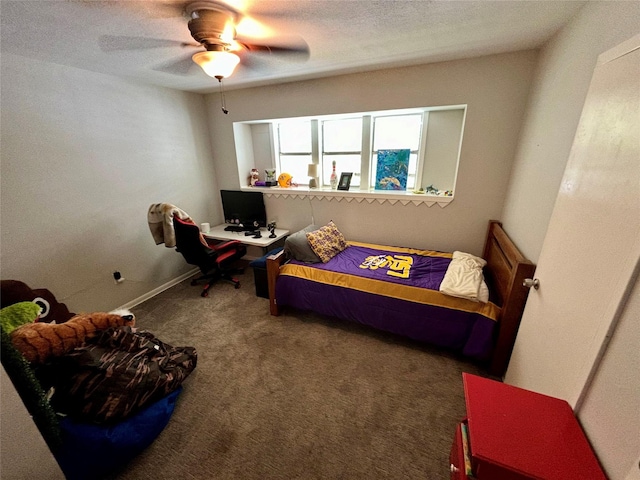 bedroom with a textured ceiling, ceiling fan, carpet flooring, and baseboards