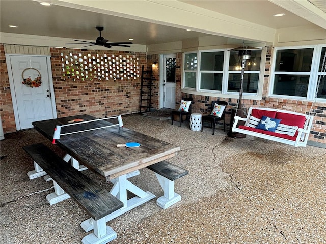 view of patio featuring outdoor dining space and a ceiling fan