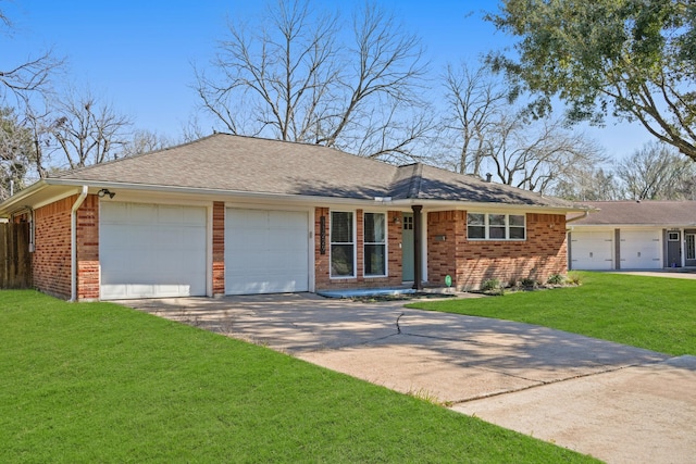 ranch-style house with driveway, brick siding, a shingled roof, an attached garage, and a front yard