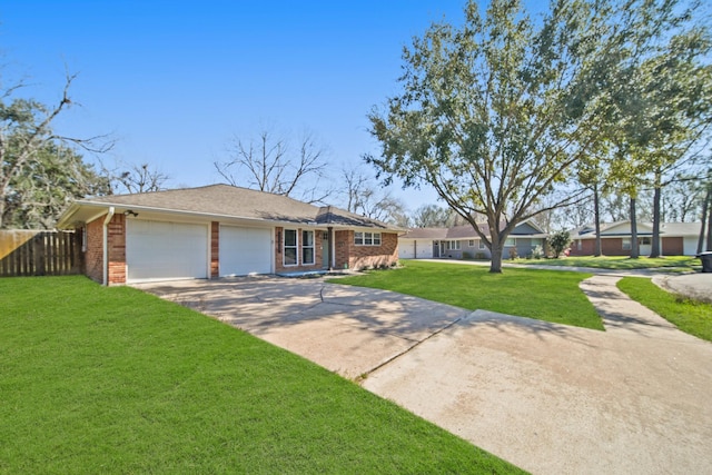 single story home featuring brick siding, fence, a garage, driveway, and a front lawn