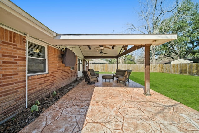 view of patio with a ceiling fan and a fenced backyard