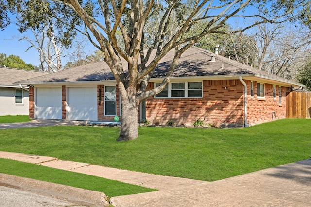 ranch-style house featuring a garage, aphalt driveway, roof with shingles, a front lawn, and brick siding