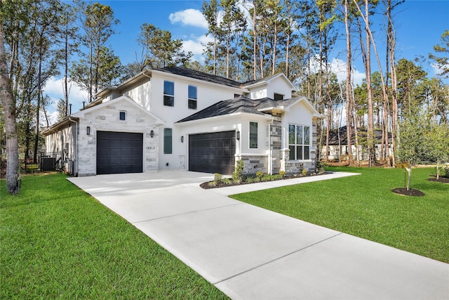 modern farmhouse style home featuring driveway, stone siding, central AC unit, and a front lawn