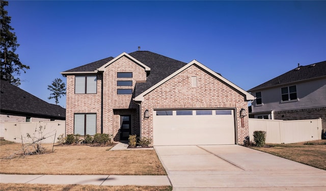 traditional home featuring driveway, brick siding, an attached garage, fence, and a front yard