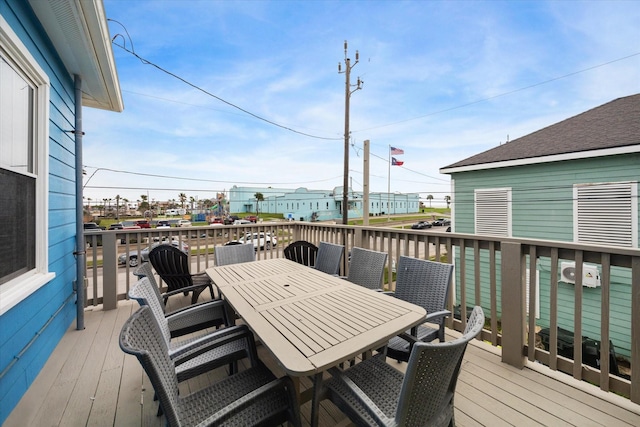 deck with outdoor dining area