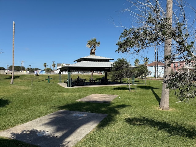 surrounding community with a yard and a gazebo