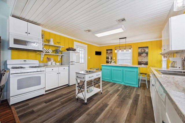 kitchen featuring white appliances, white cabinets, decorative light fixtures, light countertops, and open shelves