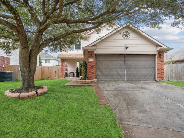 traditional-style house featuring brick siding, concrete driveway, and fence