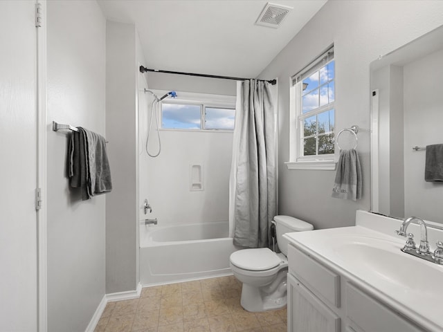 full bath with vanity, baseboards, visible vents, shower / tub combo, and toilet