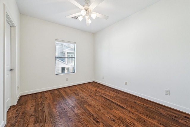 unfurnished bedroom featuring ceiling fan, dark wood-type flooring, and baseboards