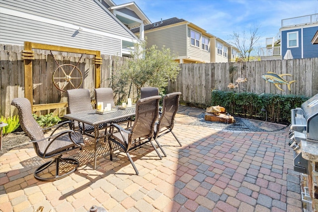 view of patio / terrace with outdoor dining space and a fenced backyard